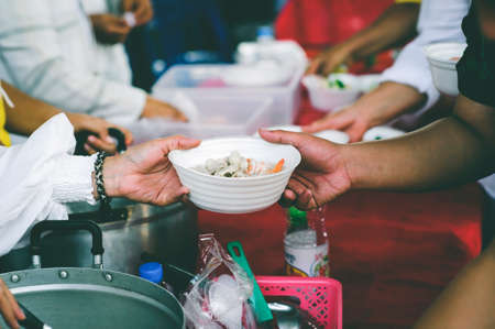 Volunteers Share Food to the Poor: concept of poverty in Asian societyの写真素材