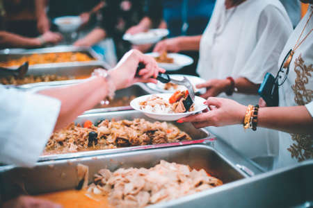 Donate food to the poor and hungry: Concept of Feedingの写真素材