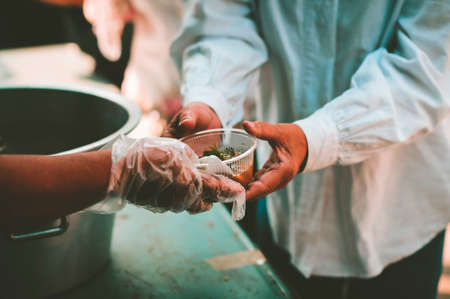 Volunteers Share Food to the Poor: The Concept of Donating Food to the Poor