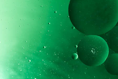 Beautiful abstraction oil drops on a water surface backgroundの写真素材