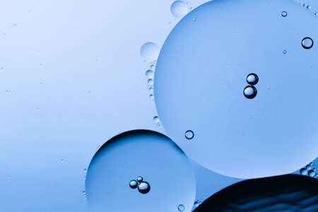 The beauty of abstract oil floating on the water surface with colored background.の写真素材