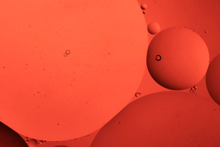 The beauty of abstract oil floating on the water surface with colored background.の写真素材