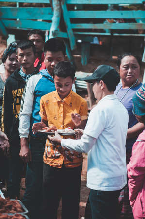 MAE HAE NOI OMKOI CHIANG MAI, THAILAND - JANUARY 10 , 2019 : Children are enjoying a delicious lunch from donations in Chiang Mai, Thailandのeditorial素材