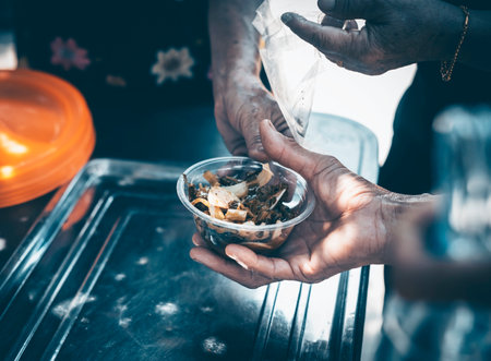 Donating food to fellow human beings is a concept of sharing.の写真素材