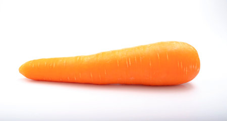 fresh carrots isolated on a white backgroundの写真素材