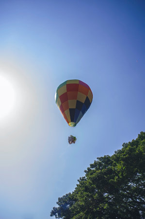 Balloons made of colorful paper filled with hot air inside are released into the sky.の写真素材