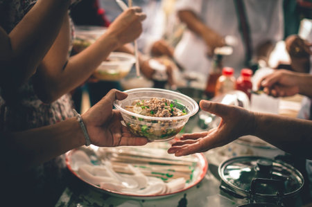 Sharing food for the hungry homeless: the concept of a sharing society.の写真素材