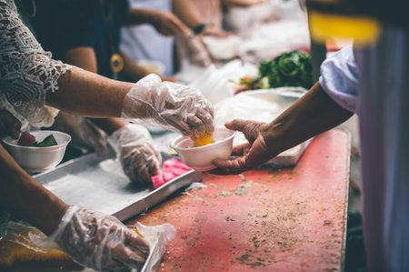Distributing food to help the poor in society : Sharing food to the hungry : Food donation conceptの写真素材
