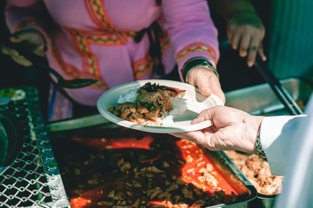 Free food distribution to the hungry in the community : volunteer food donation conceptの写真素材