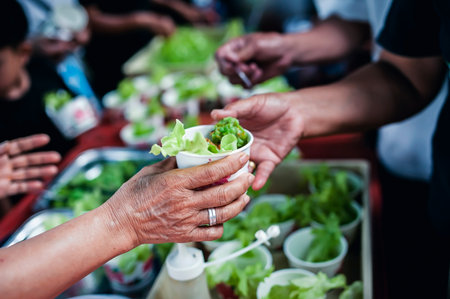 concept of charity food for the poor : the concept of life problems, hunger in society : Helping People With Hunger With Kindness : The hands of beggars receive donated foodの写真素材