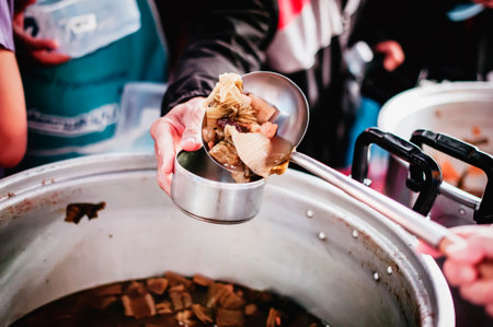 Donate leftover food to hungry people, Concept of poverty and hungerの写真素材