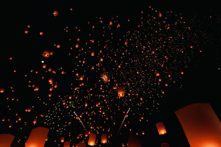 The beauty of the lanterns floating in the sky during the Yi Peng Festival and the Floating Lantern Festival in Chiang Mai Province, Thailand.の写真素材
