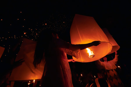 Chiang Mai - Thailand November 28, 2023 : Tourists happily celebrate releasing lanterns at the Loi Krathong Yi Peng Lantern Festival according to Thai cultural traditions.のeditorial素材