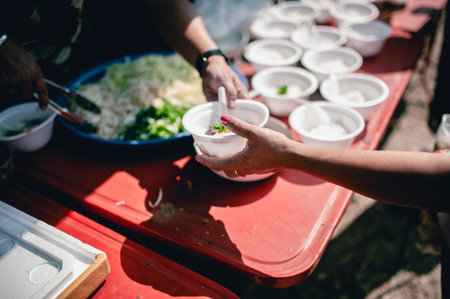 Help with feeding homeless people to alleviate hunger. poverty conceptの写真素材