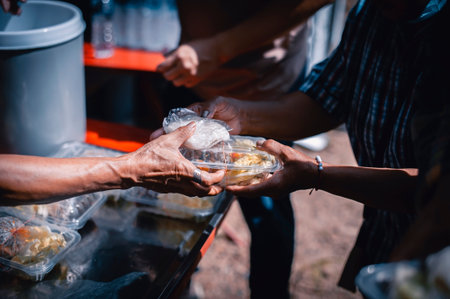Helping the poor in society by donating food . The concept of hunger