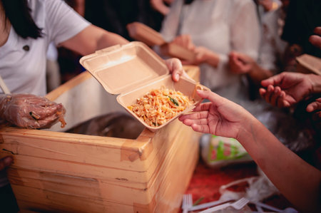Helping the poor in society by donating food . The concept of hungerの写真素材