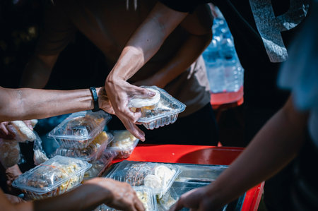 Receiving food for the poor from volunteers, concept of feeding, Homeless people receive delicious...