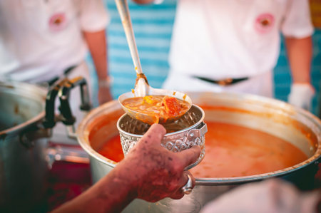 Helping the poor in society by donating food . The concept of hungerの写真素材