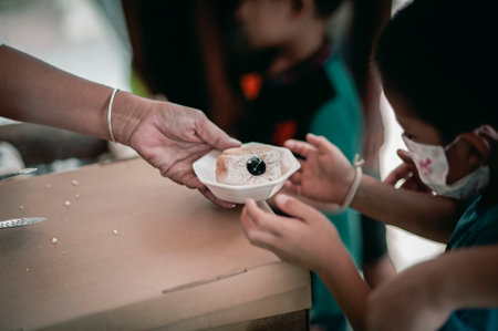 The hands of the hungry are asking for food from the donor,Out to the Homeless and Hungryの写真素材