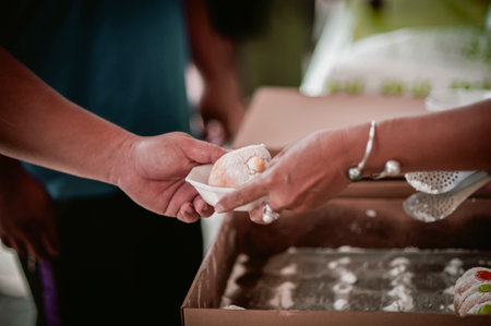 The hands of the hungry are asking for food from the donor,Out to the Homeless and Hungry