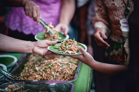 The hands of the hungry are asking for food from the donor,Out to the Homeless and Hungryの写真素材