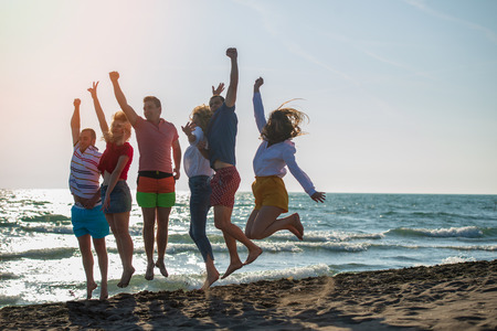 Group of friends enjoy on the beachの写真素材