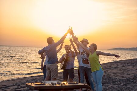 Group of friends enjoy on the beachの写真素材
