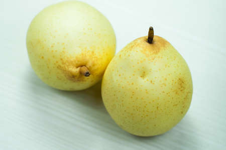 pear on a wooden white. pear isolated.の写真素材