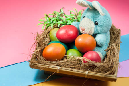 decorating Easter bunny and colorful Easter eggsの写真素材