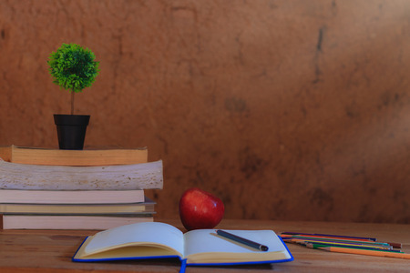 Background book on wooden table in the old earth room.の写真素材