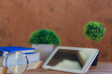 Background book on wooden table in the old earth room.の写真素材