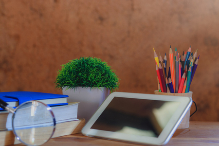 Background book on wooden table in the old earth room.の写真素材