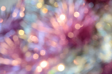 Bokeh photo. Holiday background. Christmas lights. Defocused sparkles. New Year backdrop. Festive...
