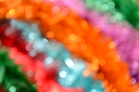 Bokeh. Holiday background. Christmas lights. Glitter. Defocused sparkles. New Year backdrop. Festive wallpaper. Blinks. Carnival. Tinsel. Bokeh retro style photo.の写真素材