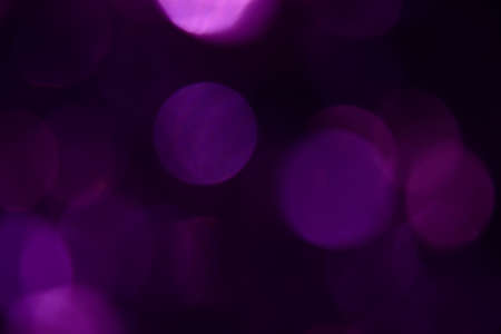 Bokeh. Holiday background. Christmas lights. Glitter. Defocused sparkles. New Year backdrop. Festive wallpaper. Blinks. Carnival. Tinsel. Bokeh retro style photo.の写真素材