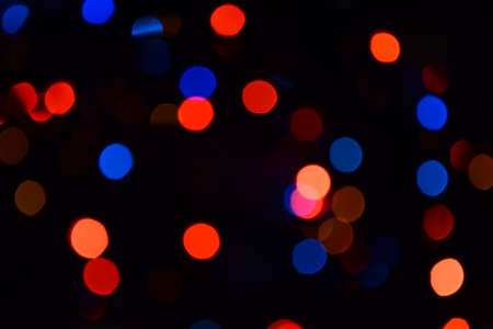 Bokeh. Christmas lights. Holiday background. Garland. Glitter. Defocused sparkles. Festive. New Year backdrop. Blinks. Carnival. Bokeh retro style photo. Multicolor. Colorful.の写真素材