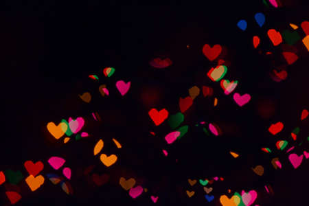 Bokeh lights background. Stars bokeh defocused background. Holiday background. Garland. Defocused...