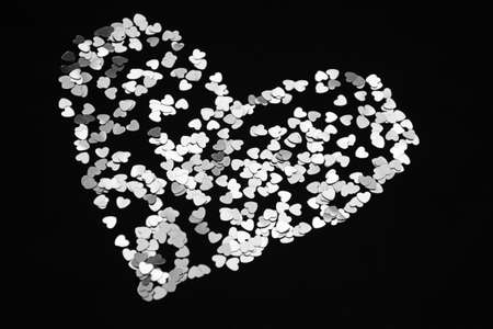 Heart made of sparkles. Valentines day symbol. Black and white photo. Romantic background can be...