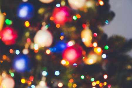 Bokeh christmas lights. Holiday background. Garland. Glitter. Defocused blinks. New Year. Bokeh retro style photo.の写真素材