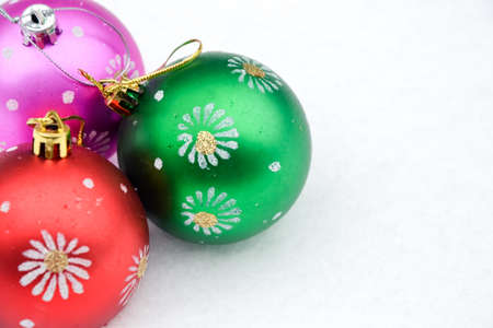 Christmas tree ball on freshly fallen snow. Cold frosty weather. White. Winter background. New Year wallpaper.の写真素材