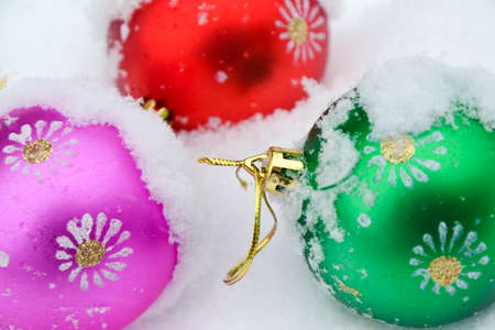 Christmas tree ball on freshly fallen snow. Cold frosty weather. White. Winter background. New Year wallpaper.の写真素材