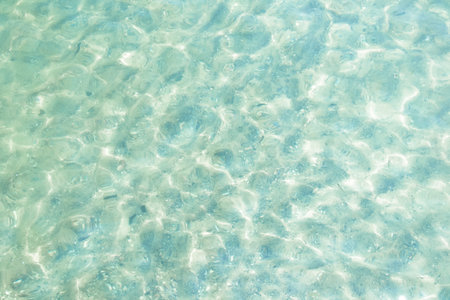 Sea water. Turquoise clear water. Summer background. Ocean water in sunny day. Tropical background.