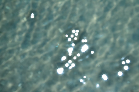 Bokeh sea water. Ocean waves background. Deep blue. Summer background. Ocean blur. Tropical resort background.の写真素材