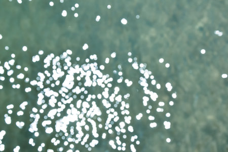 Bokeh sea water. Ocean waves background. Deep blue. Summer background. Ocean blur. Tropical resort background.の写真素材