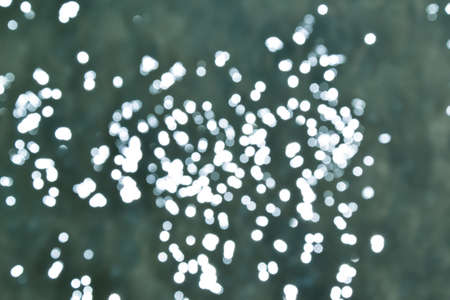 Bokeh sea water. Ocean waves background. Deep blue. Summer background. Ocean blur. Tropical resort...