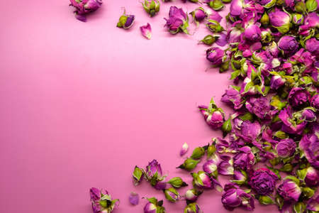 Dried pink roses. Beautiful pink flowers. Herbal plant. Dry pink rosebuds background.の写真素材