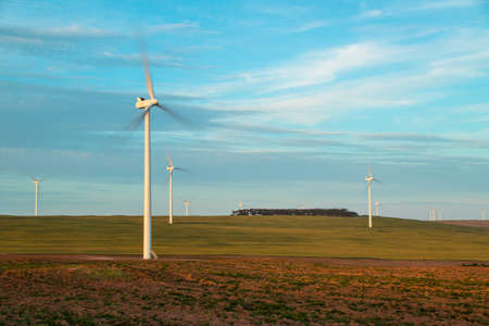 Wind Turbines Against beautiful cloudy skyの写真素材