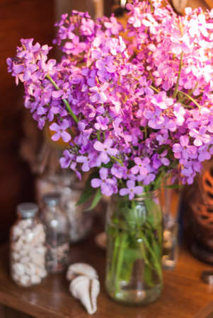 Still life with lilac summer flowers on the tableの写真素材