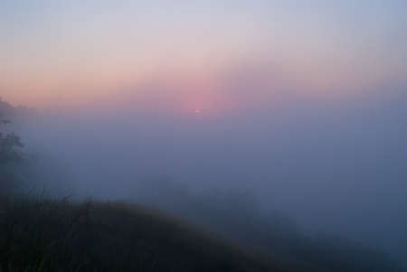 Sunrise over the cliff. morning haze at dawn under the cliff. Dawn on Zmievsky Kruchi in summer. freshnessの写真素材