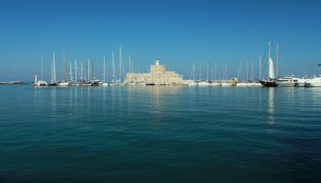 Greece, Rhodes. Wild olive plantations against the backdrop of a lake. Olive plantations.